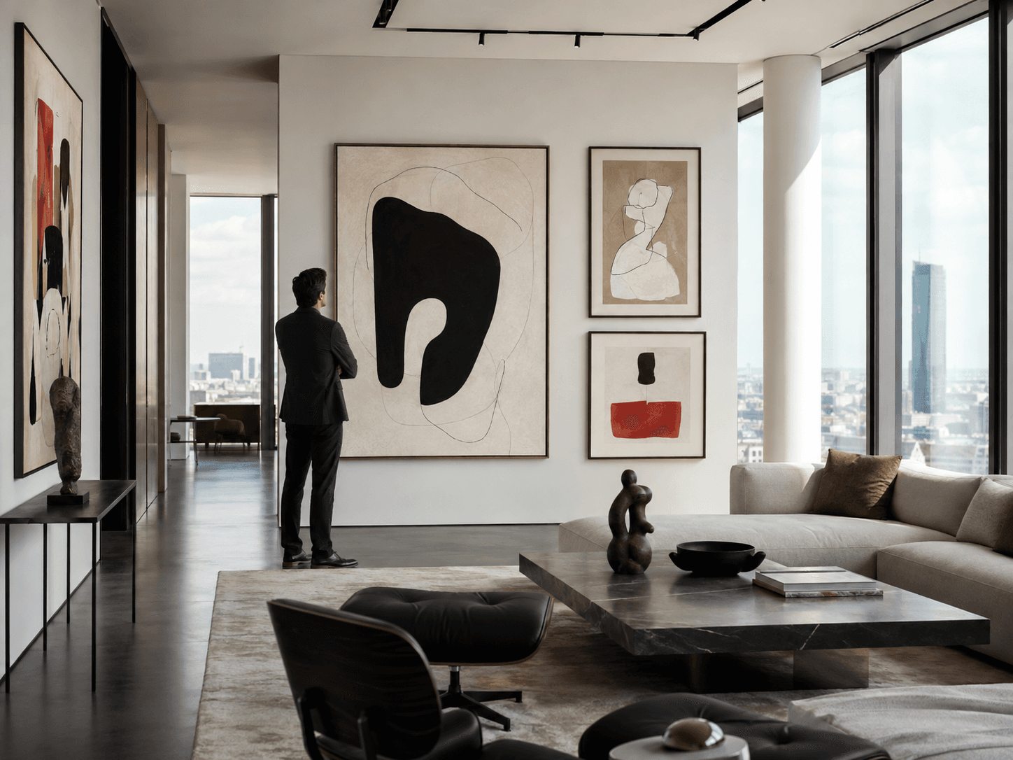 A collector standing among contemporary artworks in a private collection
